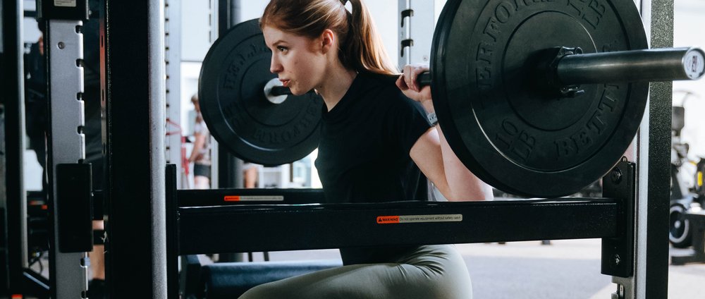 Woman working with gym equipment